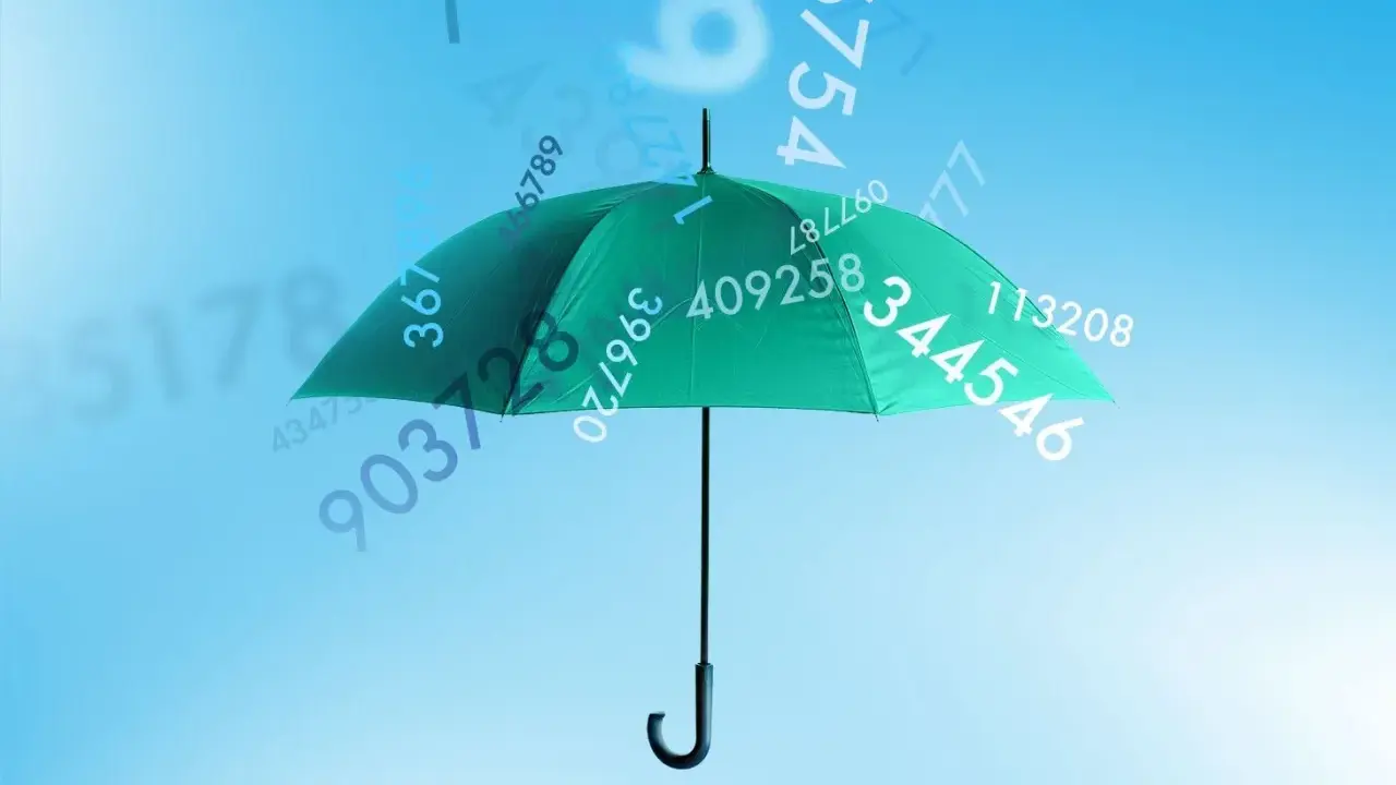 Ein grüner Regenschirm schützt vor fallenden Zahlen. Vielleicht ist das das Geheimnis für ein sicheres Passwort, einmal Passwort.