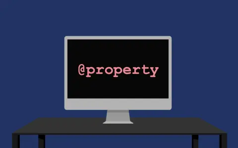 Ein Monitor zeigt "@property" in Python.